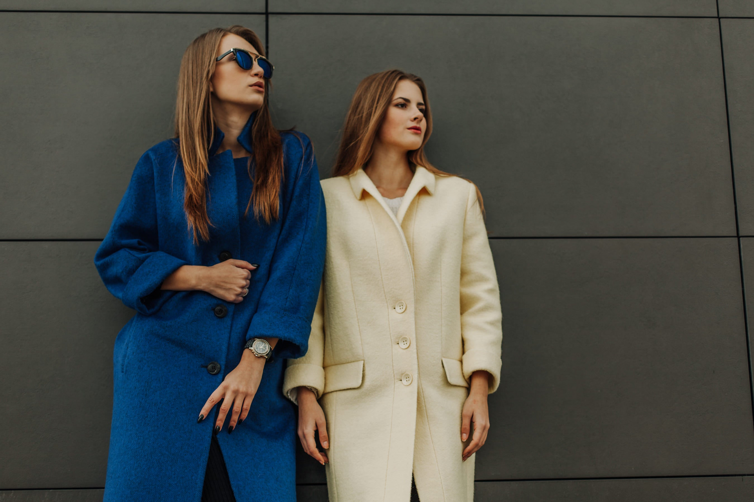 Fall Fashion Colors, Two young pretty girls wearing coats walking together at the autumn