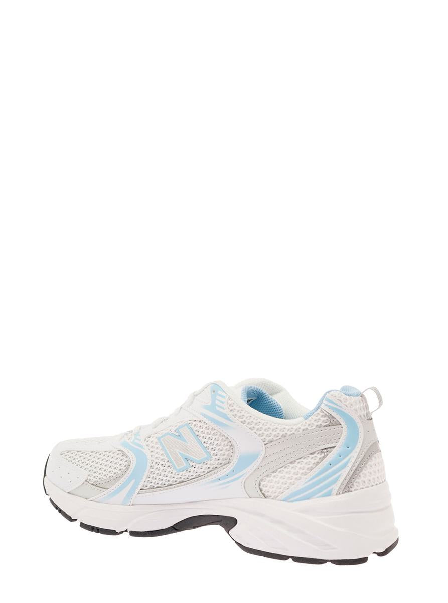 '530' white and light blue low top sneakers with logo patch in tech fabric man